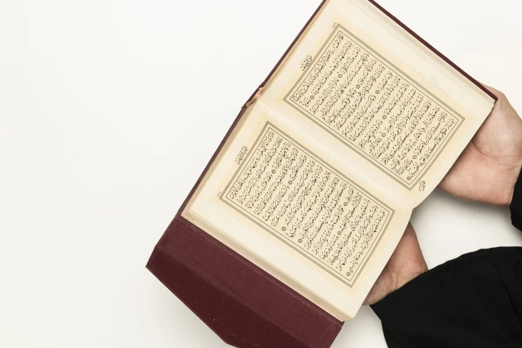 Online Quran Memorization Course 9 high angle priest holding holy book min