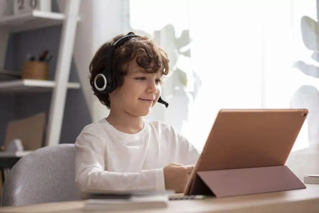 Home 4 Child studying with tablet and headphones.